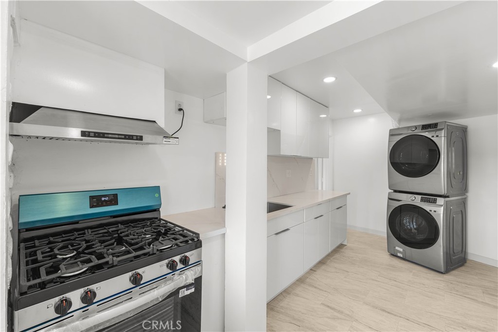 6308 Hawarden Drive Riverside, CA 92506 - Photo 20 of 37 a kitchen with white cabinets and appliances