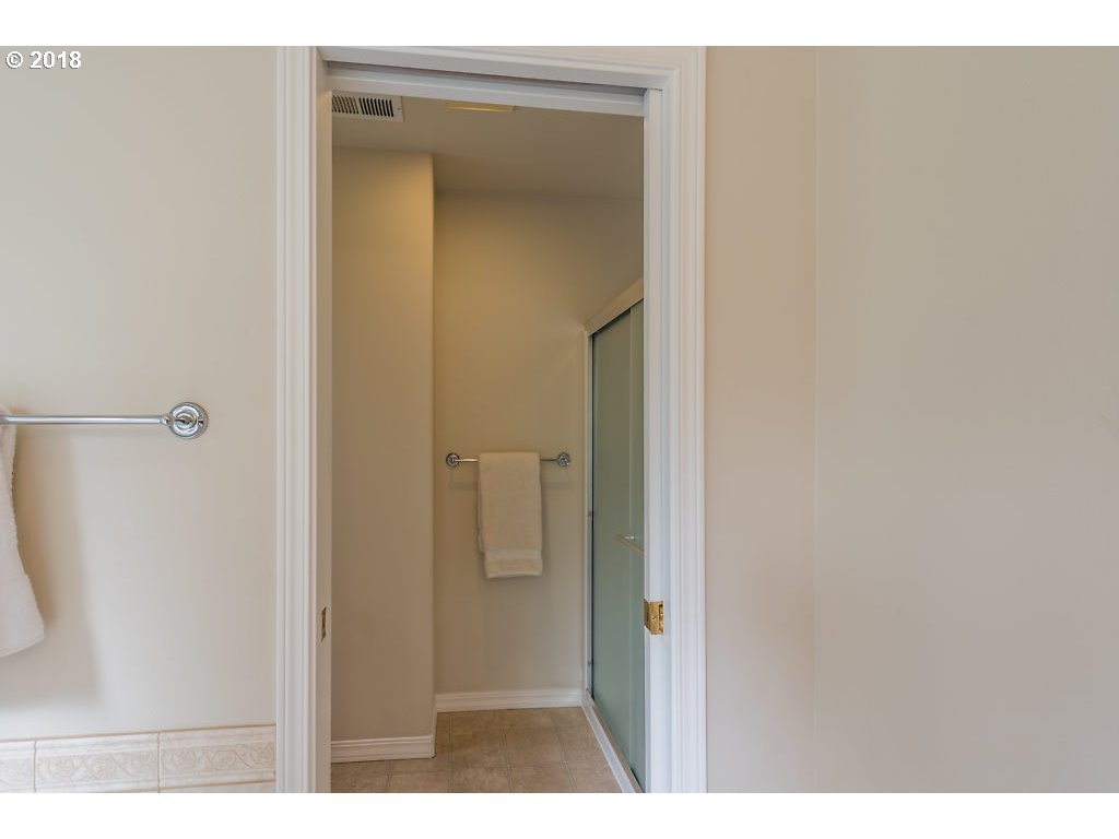 7571 Southwest Mapleleaf Street Portland, OR 97223 - Photo 20 of 32 a view of a bathroom from a hallway