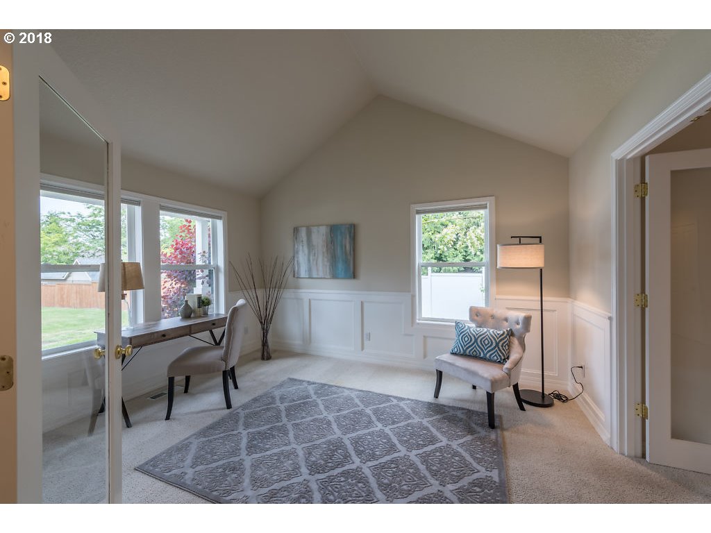 7571 Southwest Mapleleaf Street Portland, OR 97223 - Photo 2 of 32 a living room with furniture and a large window