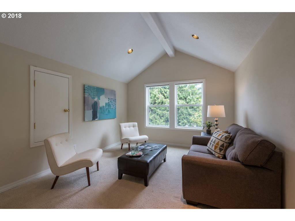 7571 Southwest Mapleleaf Street Portland, OR 97223 - Photo 23 of 32 a living room with furniture and a window