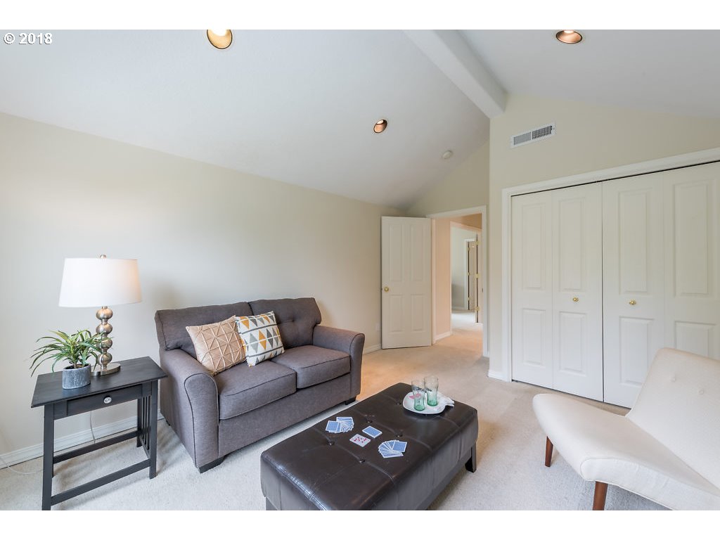7571 Southwest Mapleleaf Street Portland, OR 97223 - Photo 24 of 32 a living room with furniture and wooden floor