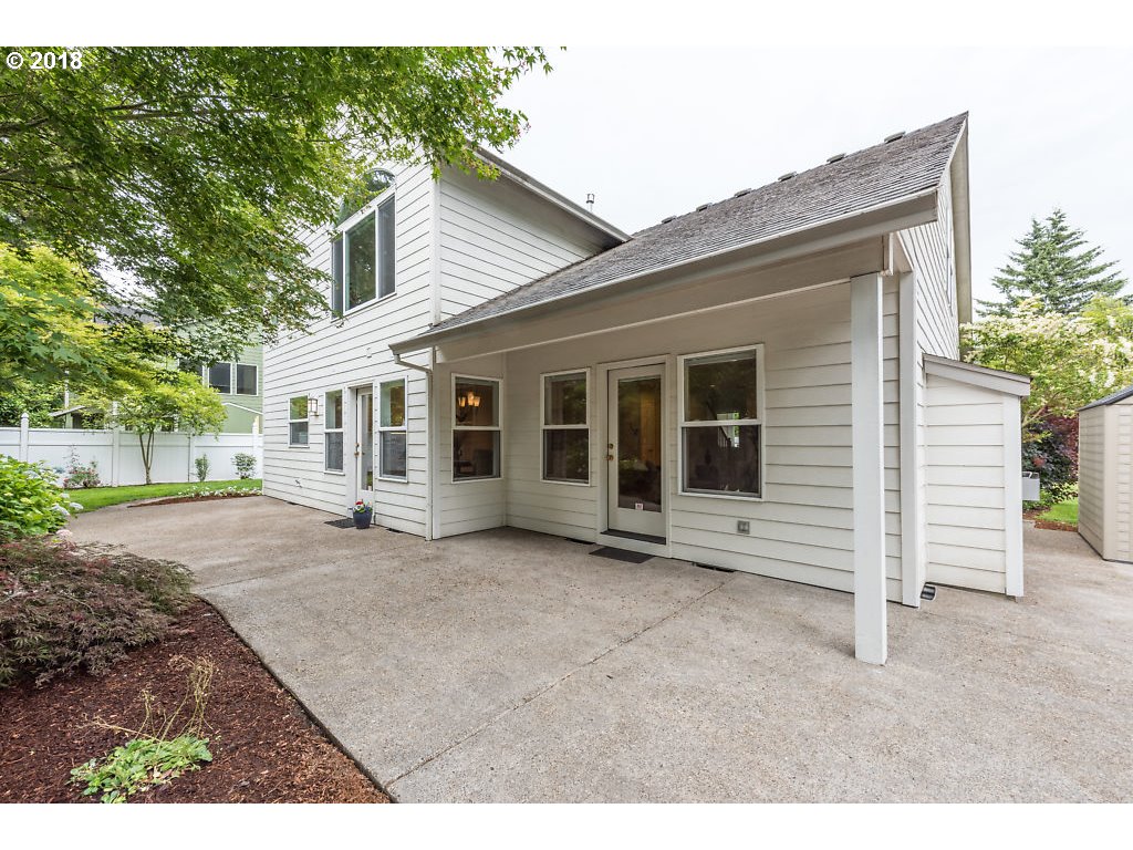 7571 Southwest Mapleleaf Street Portland, OR 97223 - Photo 26 of 32 a view of a house with a backyard