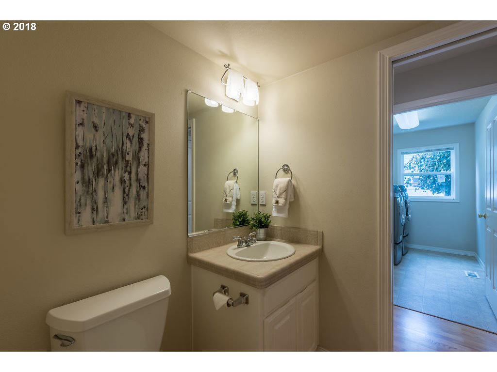 7571 Southwest Mapleleaf Street Portland, OR 97223 - Photo 8 of 32 a bathroom with a sink and a mirror