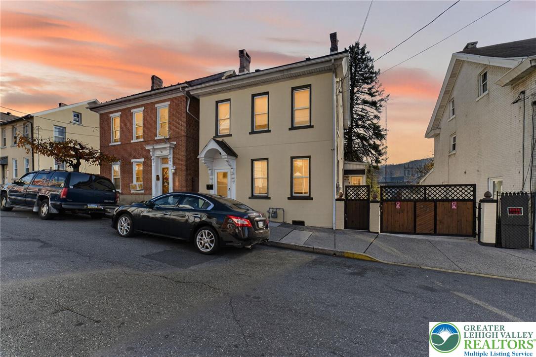 a car parked in front of a house