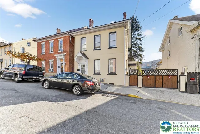 a car parked in front of a house