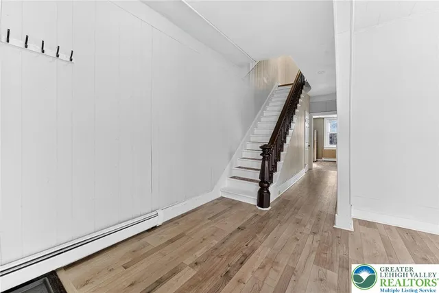 a view of entryway with wooden floor