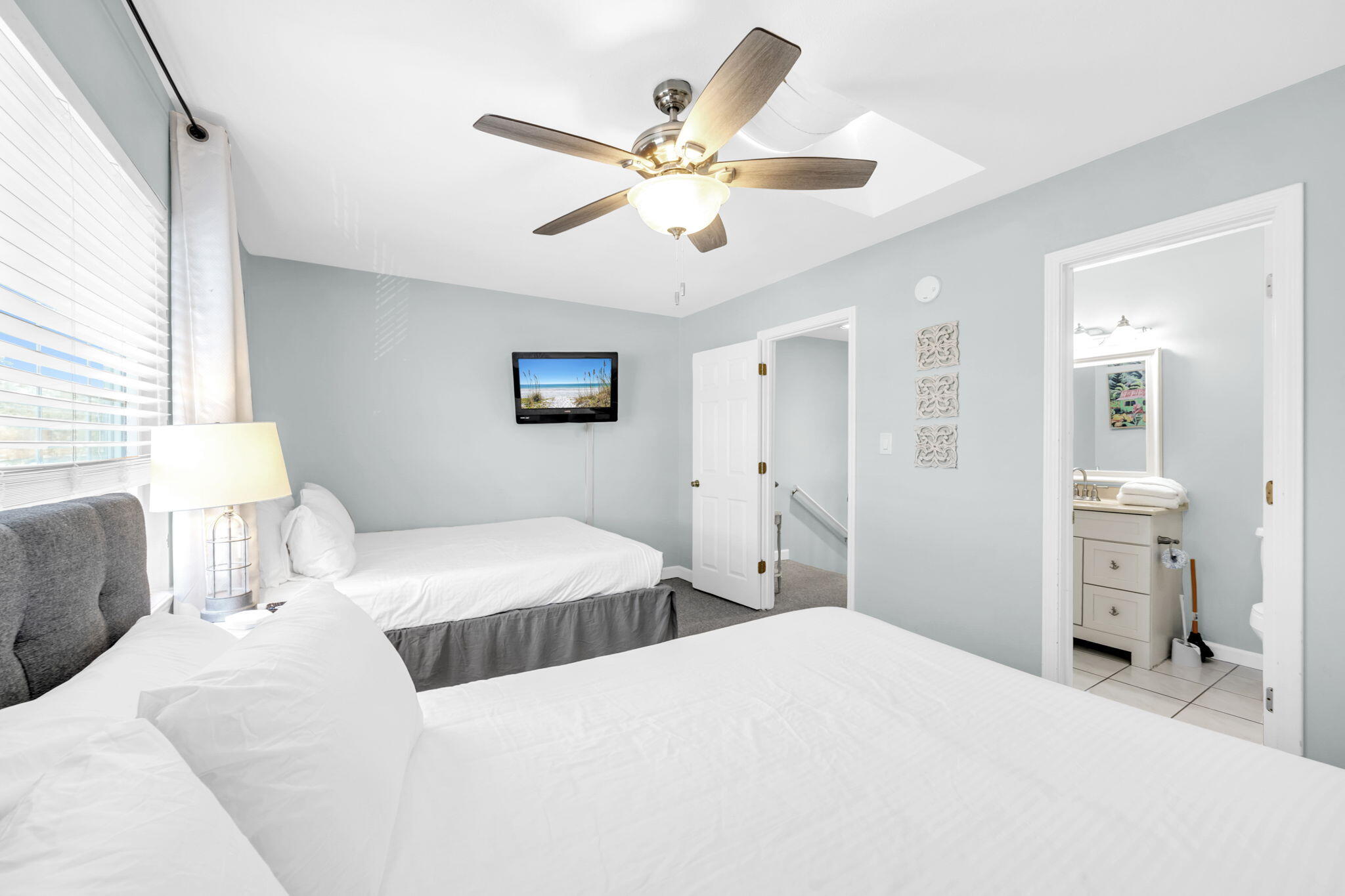 241 Ellis Road, Unit 43 Miramar Beach, FL 32550 - Photo 30 of 49 a bedroom with a bed and a chandelier