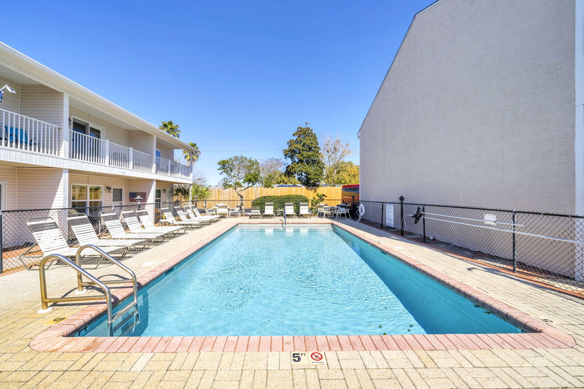 241 Ellis Road, Unit 43 Miramar Beach, FL 32550 - Photo 38 of 49 a view of a swimming pool with an outdoor seating