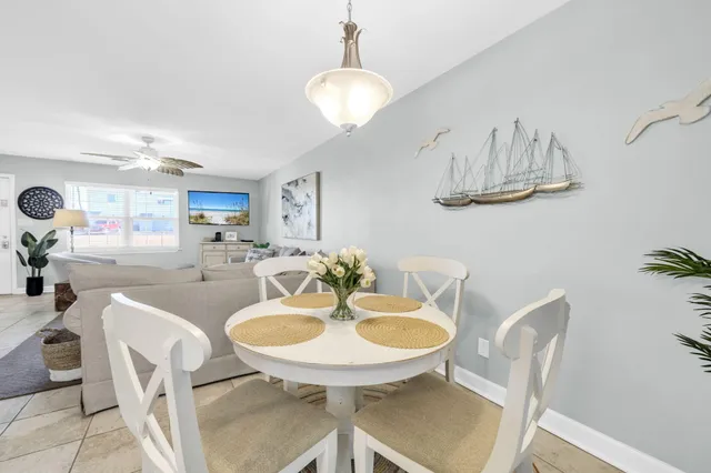 a bed room with a bed and a chandelier