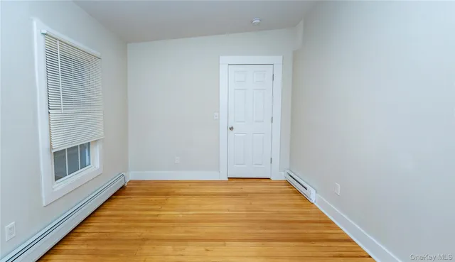 a view of a hallway with a white door