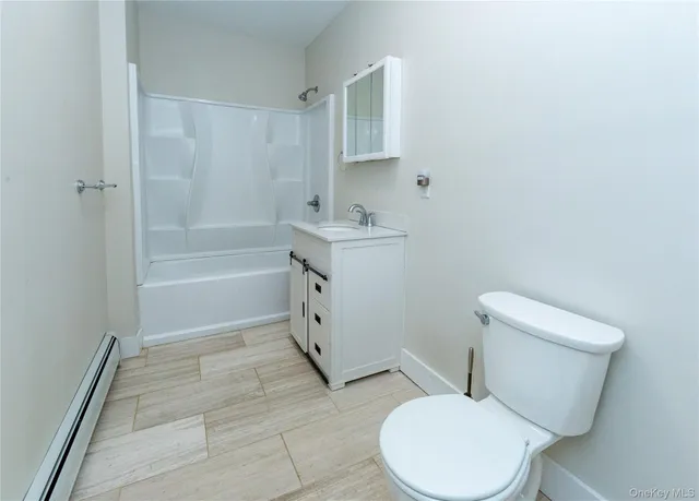 a bathroom with a sink toilet and vanity