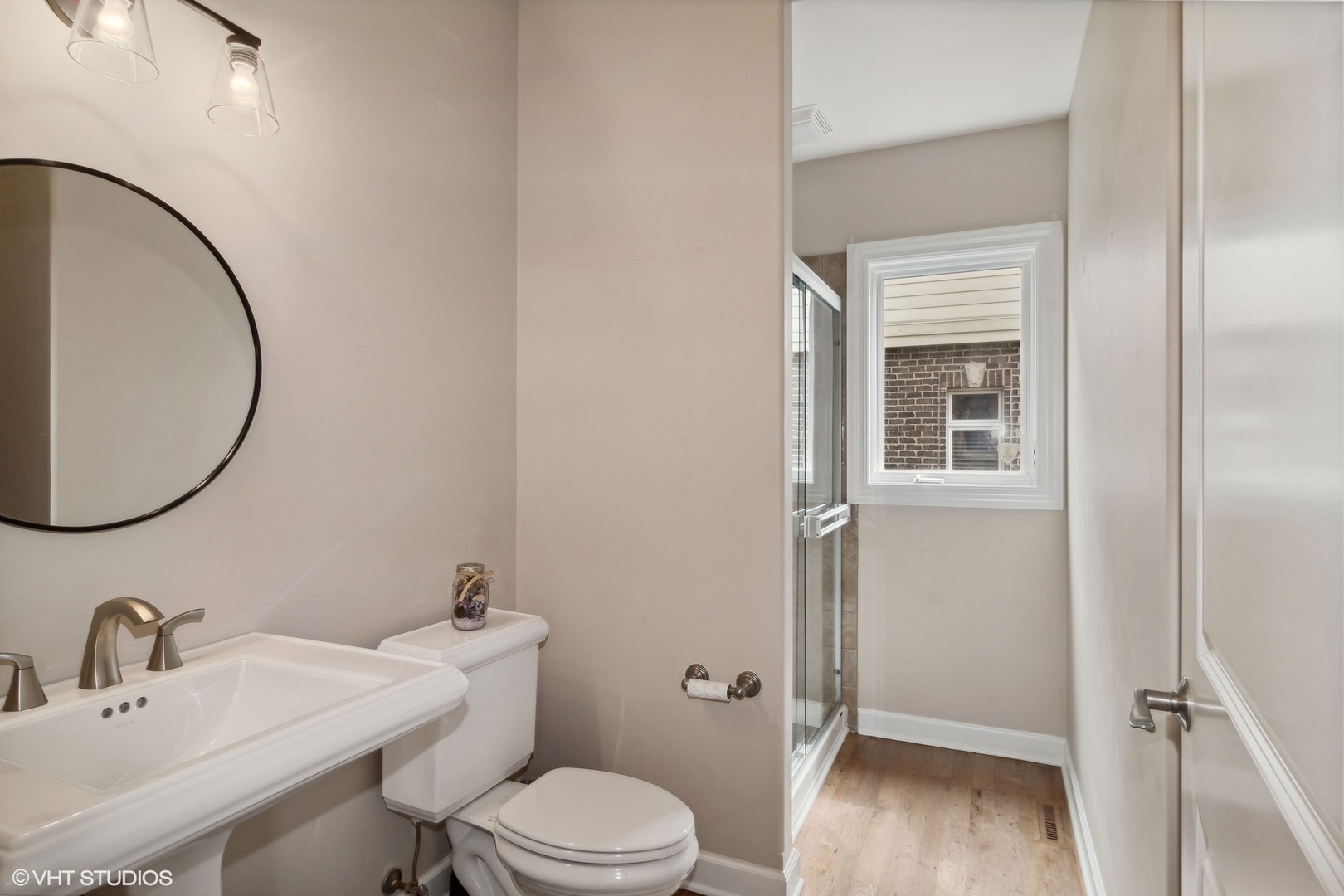 36 Ford Lane Naperville, IL 60565 - Photo 17 of 42 a bathroom with a toilet a sink and mirror
