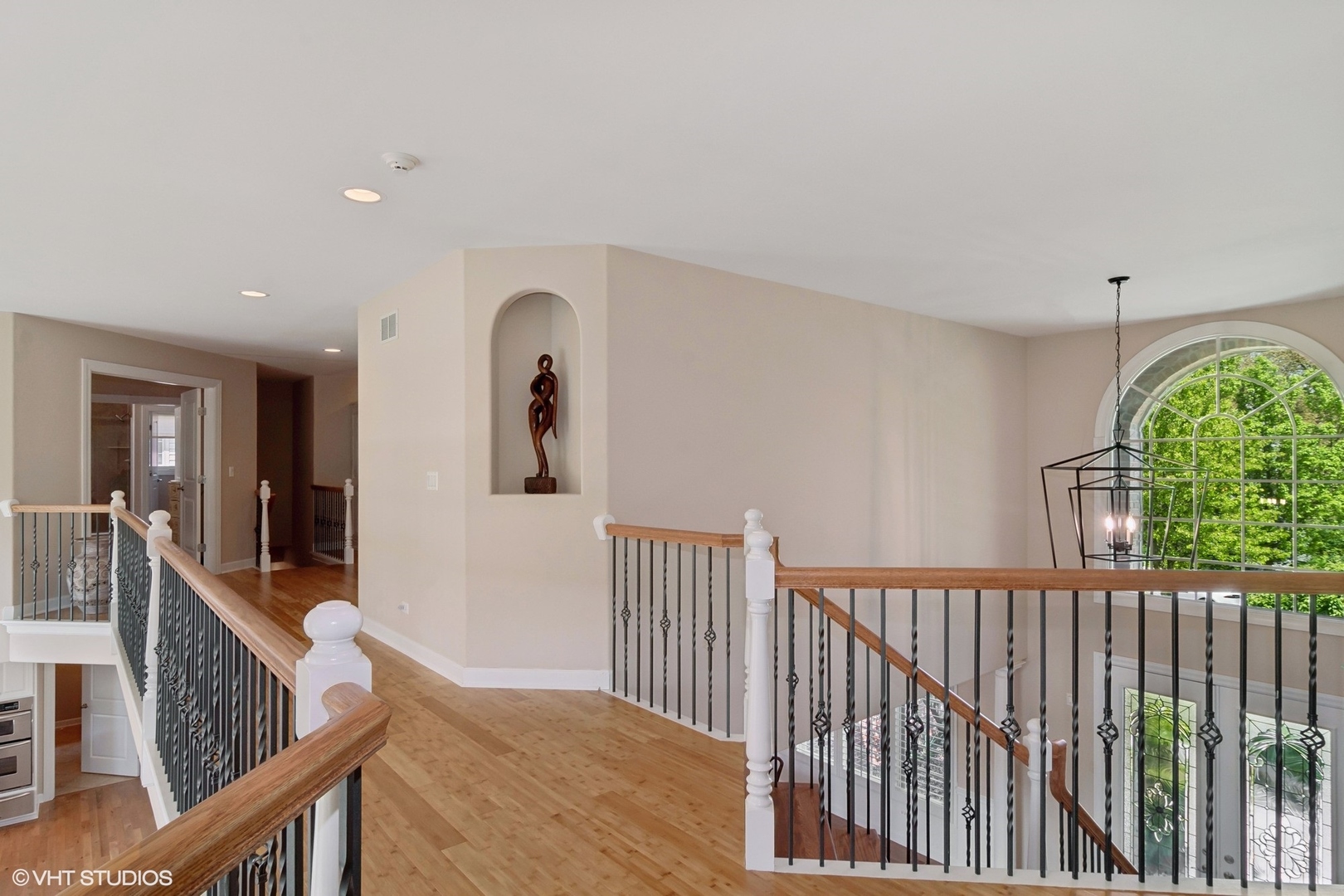 36 Ford Lane Naperville, IL 60565 - Photo 19 of 42 a view of a hallway with wooden floor and windows