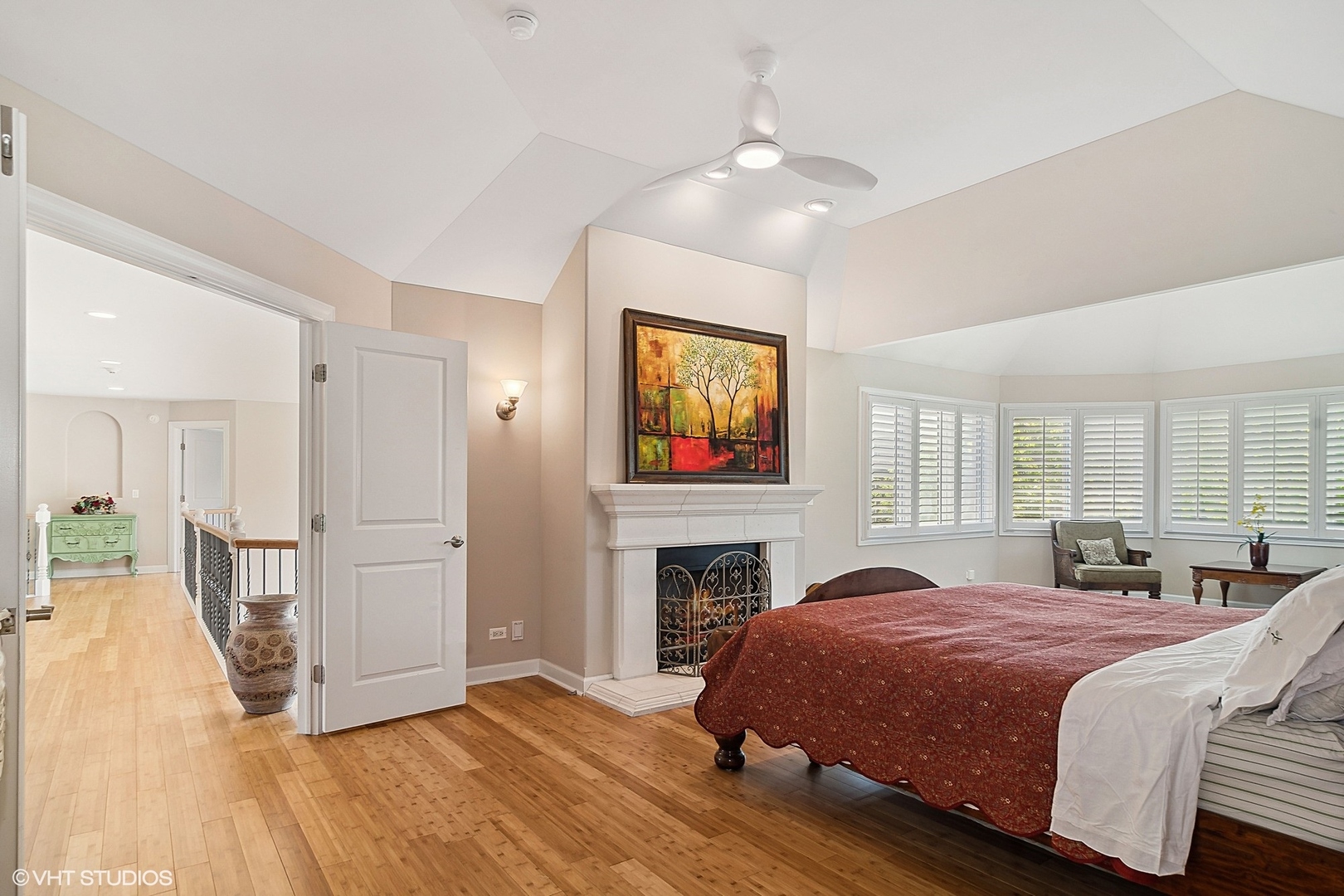 36 Ford Lane Naperville, IL 60565 - Photo 21 of 42 a spacious bedroom with a bed and a fireplace