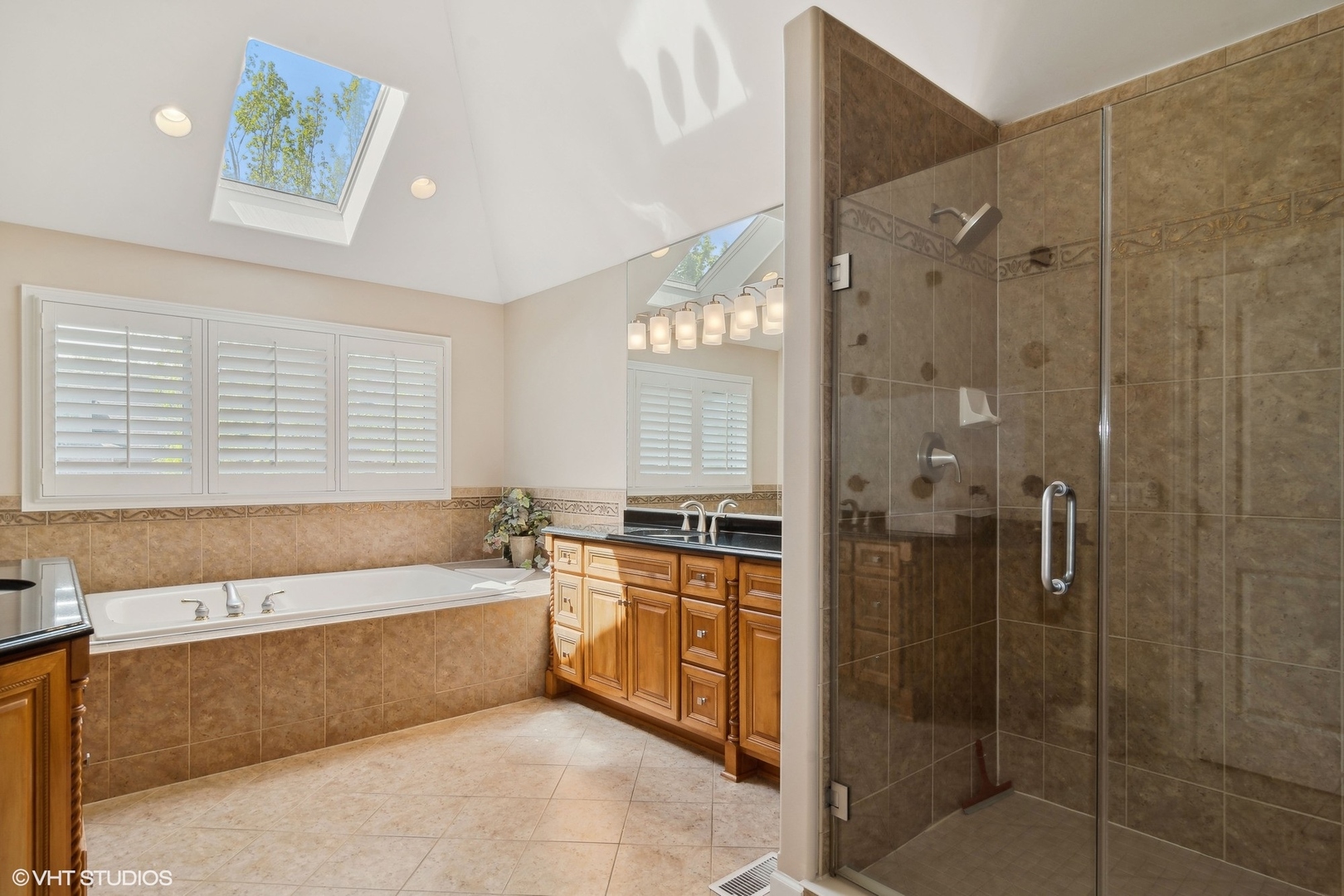 36 Ford Lane Naperville, IL 60565 - Photo 22 of 42 a spacious bathroom with a tub sink shower and mirror