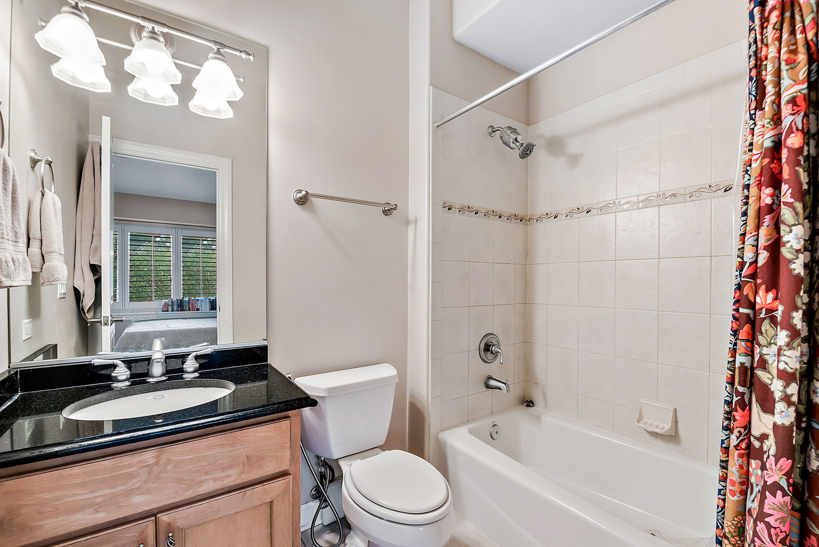 36 Ford Lane Naperville, IL 60565 - Photo 24 of 42 a bathroom with a granite countertop sink toilet a mirror and shower