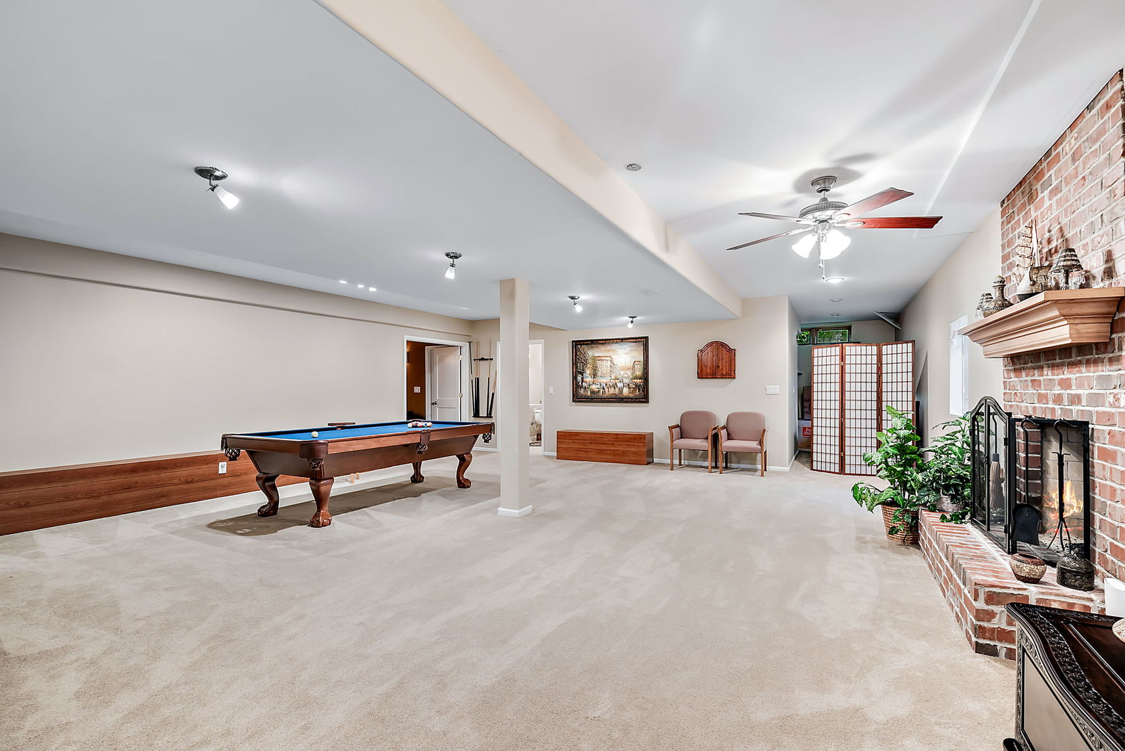 36 Ford Lane Naperville, IL 60565 - Photo 30 of 42 a living room with furniture and a chandelier
