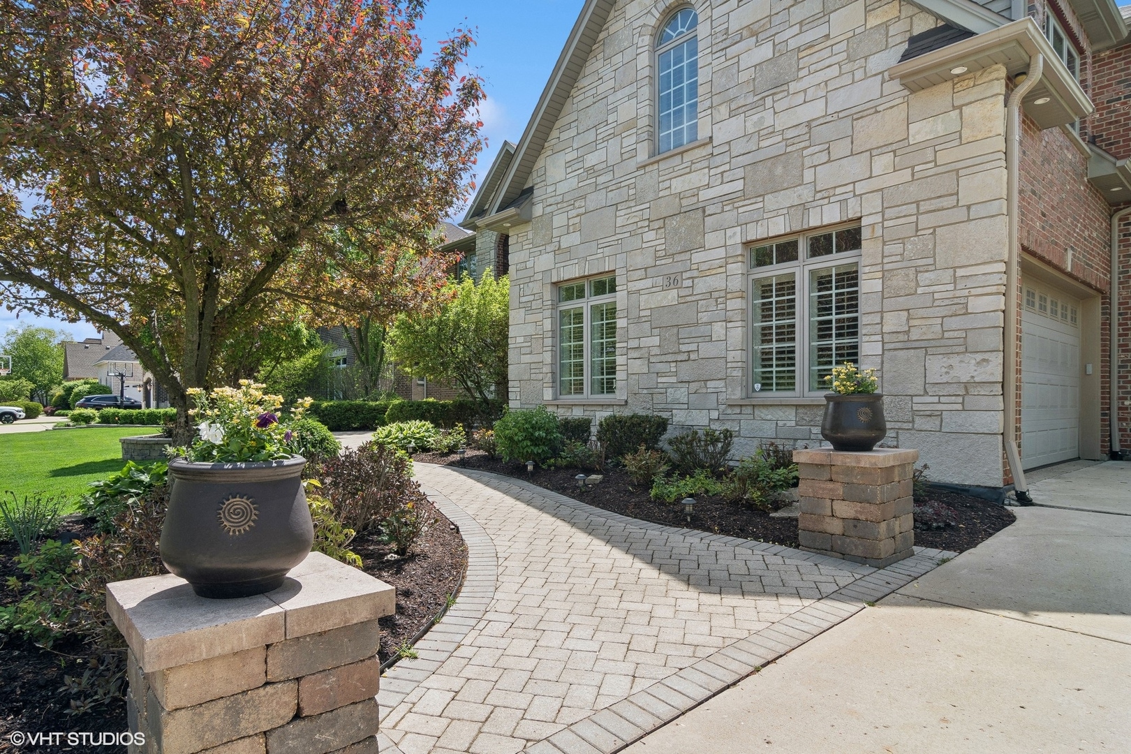 36 Ford Lane Naperville, IL 60565 - Photo 3 of 42 a view of a patio with chairs and plants