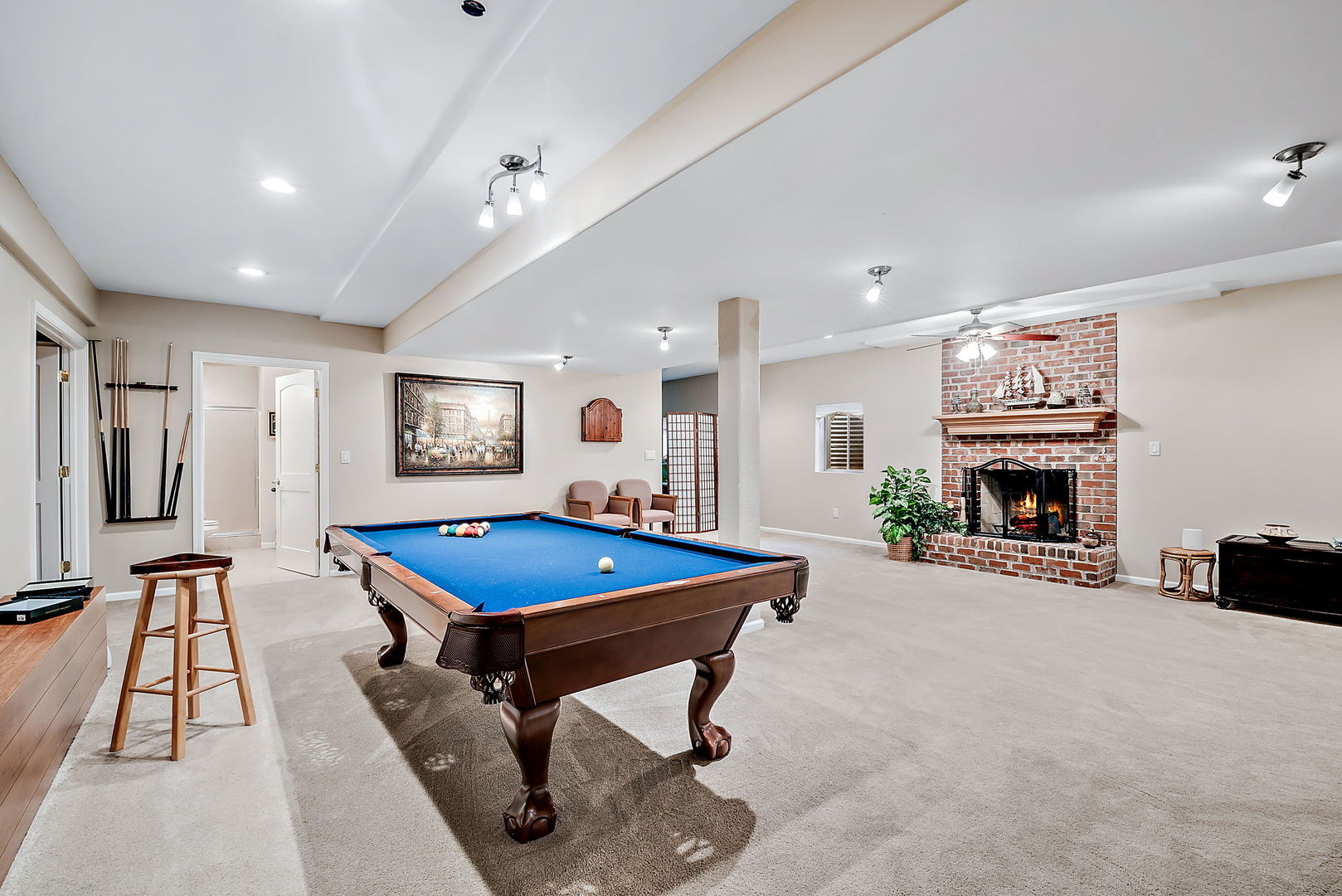 36 Ford Lane Naperville, IL 60565 - Photo 32 of 42 a room with furniture pool table flat screen tv and a fireplace