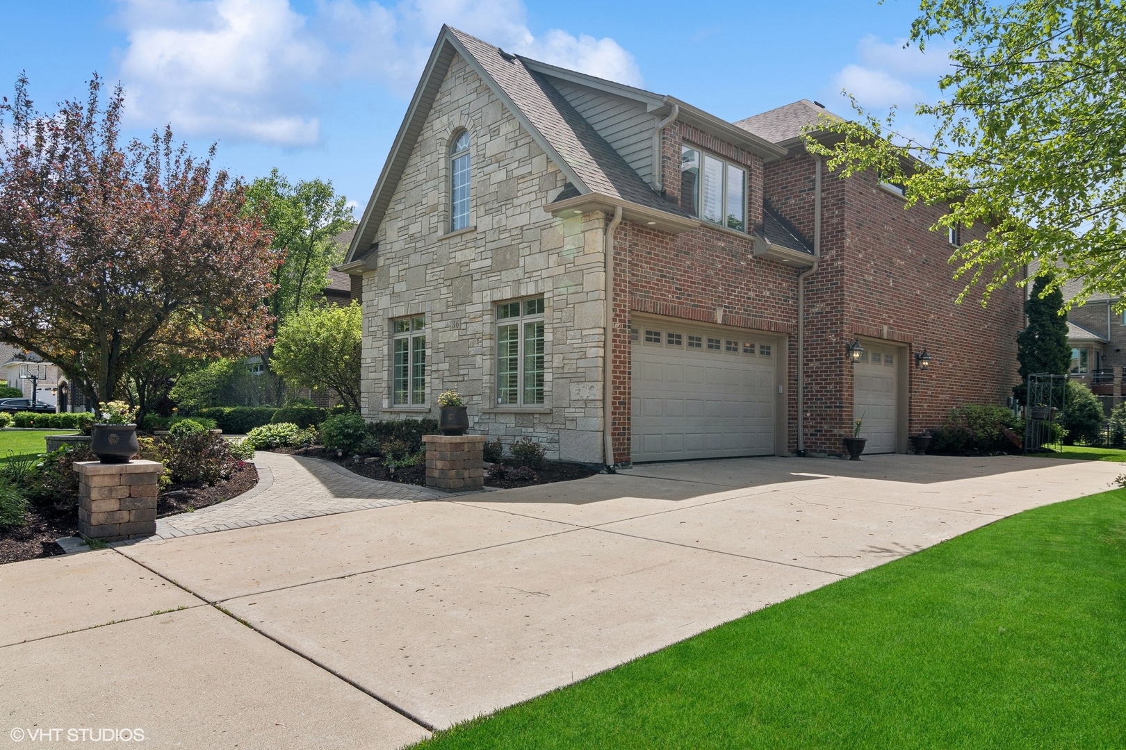 36 Ford Lane Naperville, IL 60565 - Photo 6 of 42 a front view of a house with a garden