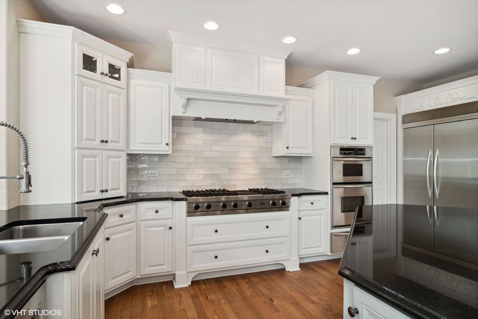 36 Ford Lane Naperville, IL 60565 - Photo 8 of 42 a kitchen with granite countertop white cabinets and stainless steel appliances
