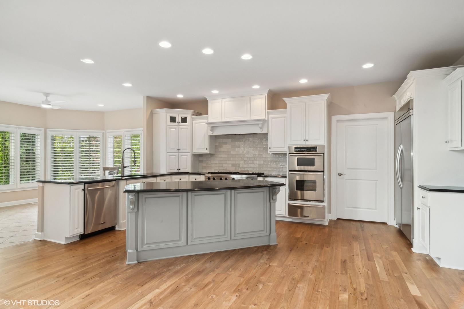 36 Ford Lane Naperville, IL 60565 - Photo 10 of 42 a large kitchen with stainless steel appliances granite countertop a stove a sink and a refrigerator
