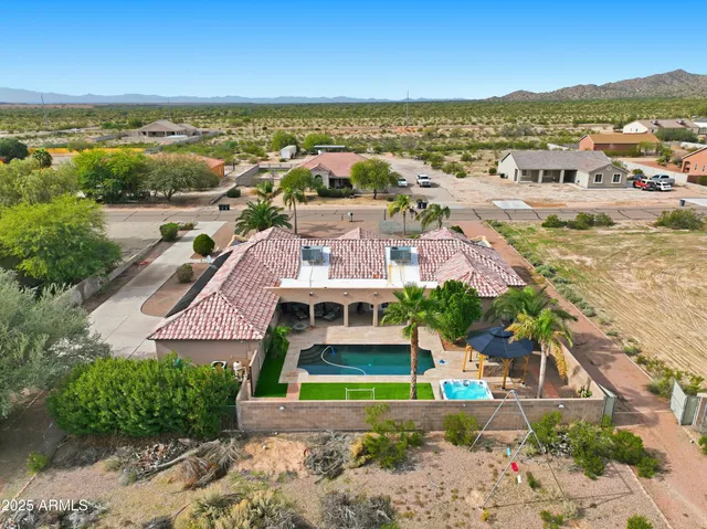 an aerial view of residential building with outdoor space and ocean view