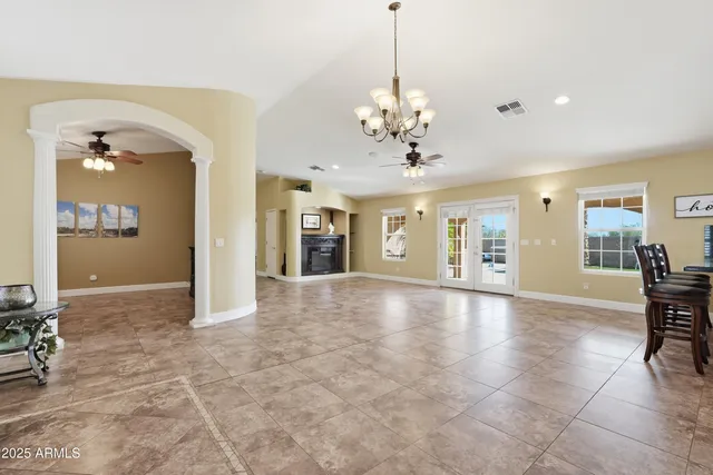 a view of a livingroom with furniture and chandelier
