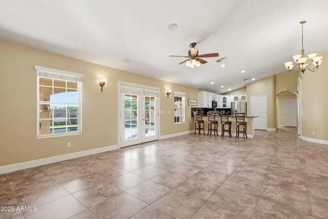 a view of kitchen with furniture and refrigerator