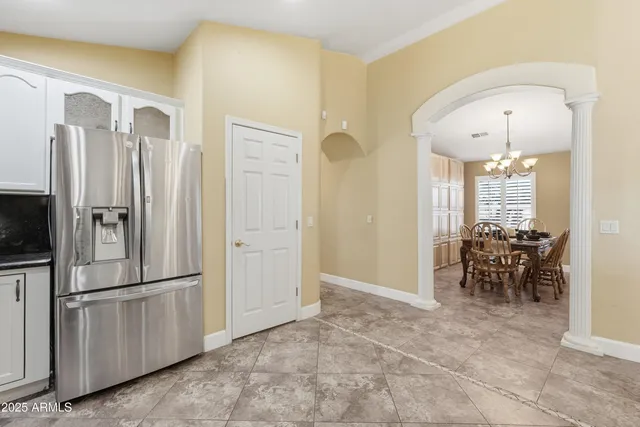a kitchen with stainless steel appliances a refrigerator and microwave
