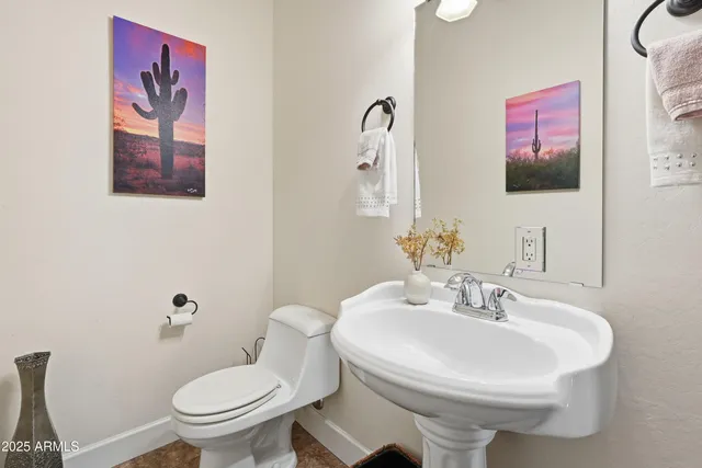 a spacious bathroom with a granite countertop sink and a mirror