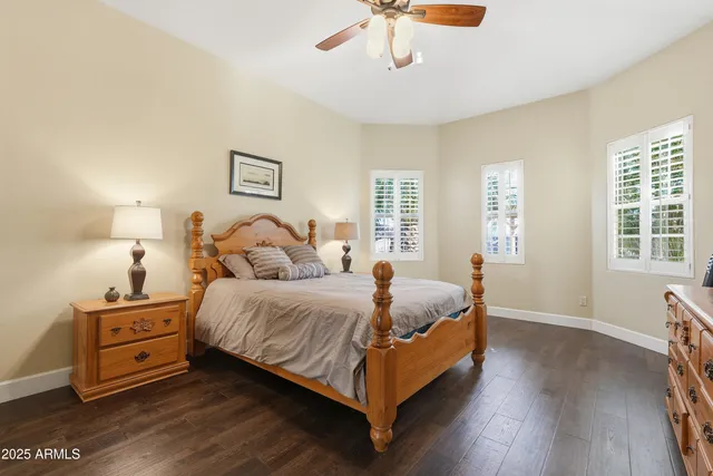 a spacious bathroom with a tub and a large window