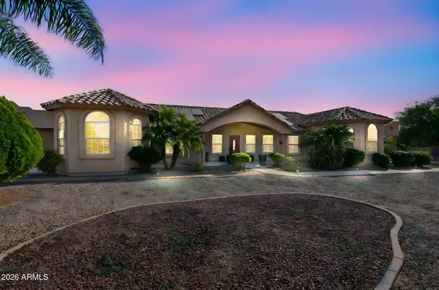 an aerial view of residential building with outdoor space and ocean view