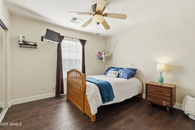 a blue and white house with a outdoor space