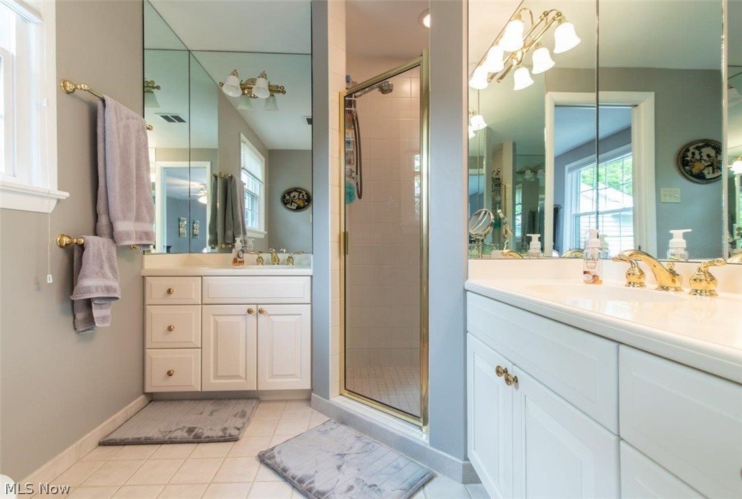 2667 Cranlyn Road Shaker Heights, OH 44122 - Photo 24 of 35 En-suite Full Bathroom with
Two Separate Vanities and
Stall Shower