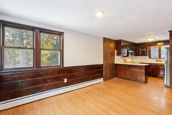 a view of kitchen with cabinets and outdoor space