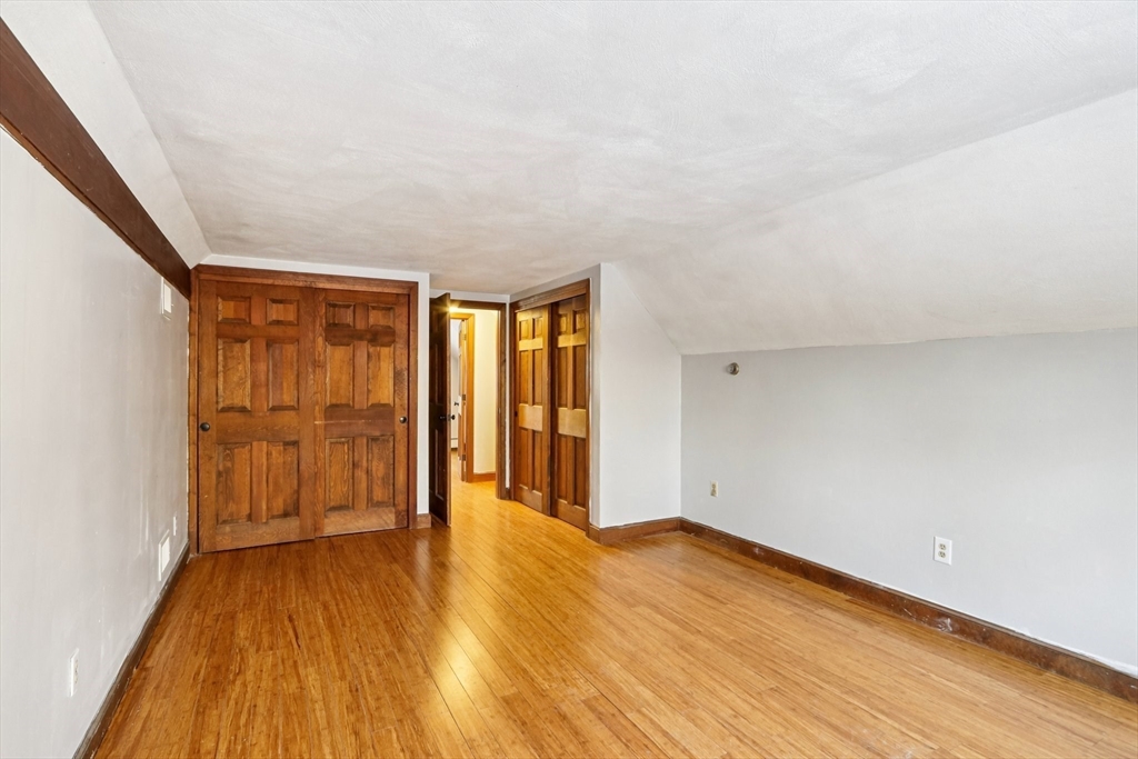 143 Hudson Road Stow, MA 01775 - Photo 29 of 42 wooden floor in an empty room with a window