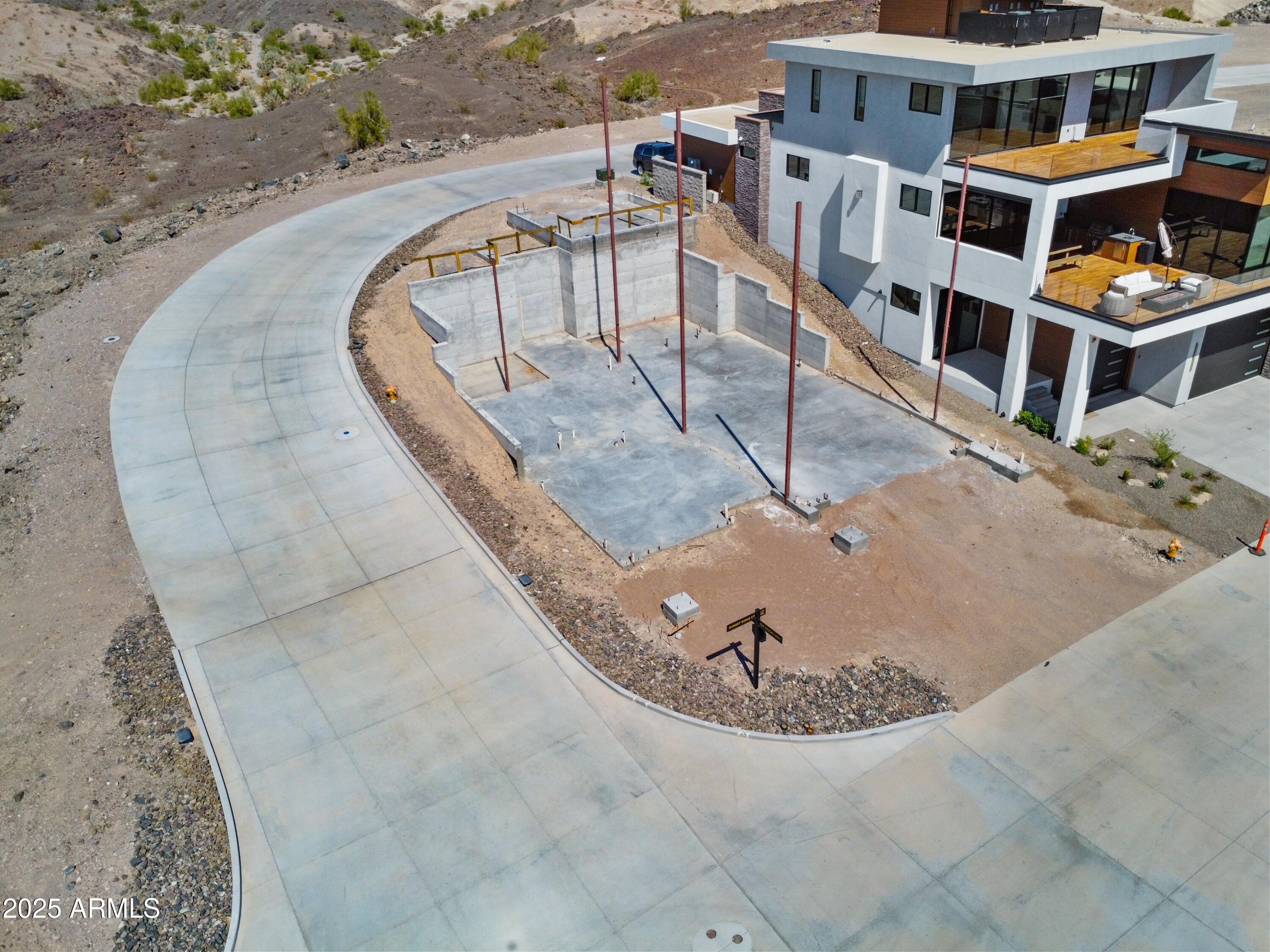 2436 The Rdgs Way, Unit 49 Lake Havasu City, AZ 86406 - Photo 9 of 12 an aerial view of a house with outdoor space