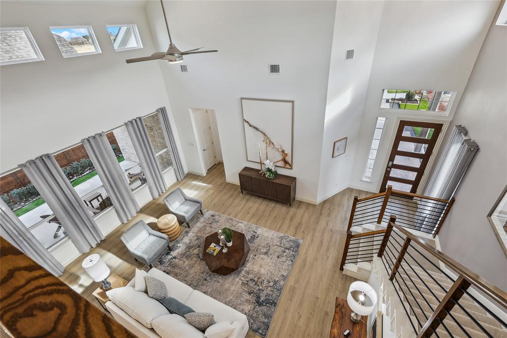 1604 Casting Ridge Mesquite, TX 75181 - Photo 23 of 38 Two-story living area featuring a vaulted ceiling and a contemporary ceiling fan
