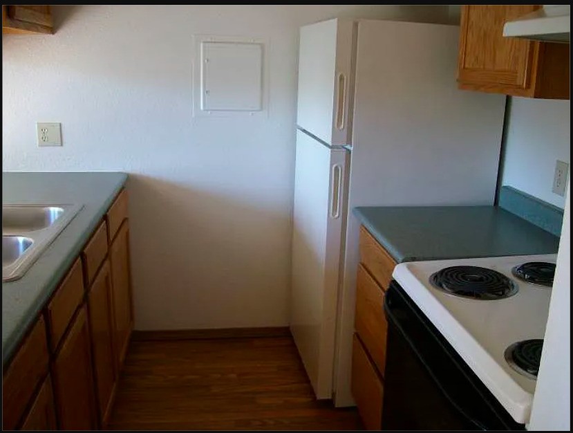2107 North Laventure Road Mount Vernon, WA 98273 - Photo 3 of 10 a kitchen with a refrigerator and a sink