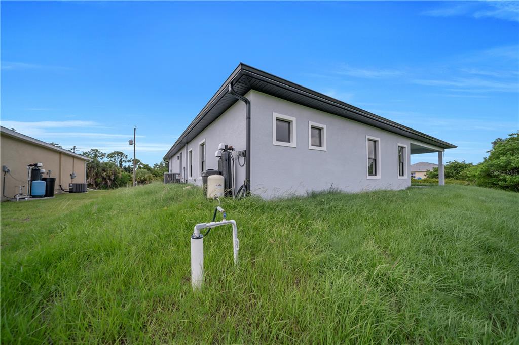 2328 Irondale Road North Port, FL 34287 - Photo 39 of 45 a view of a house with backyard and garden
