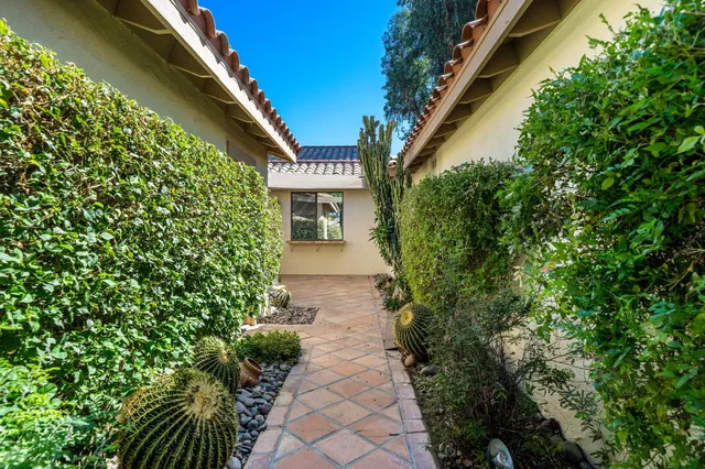 a view of a pathway with a house