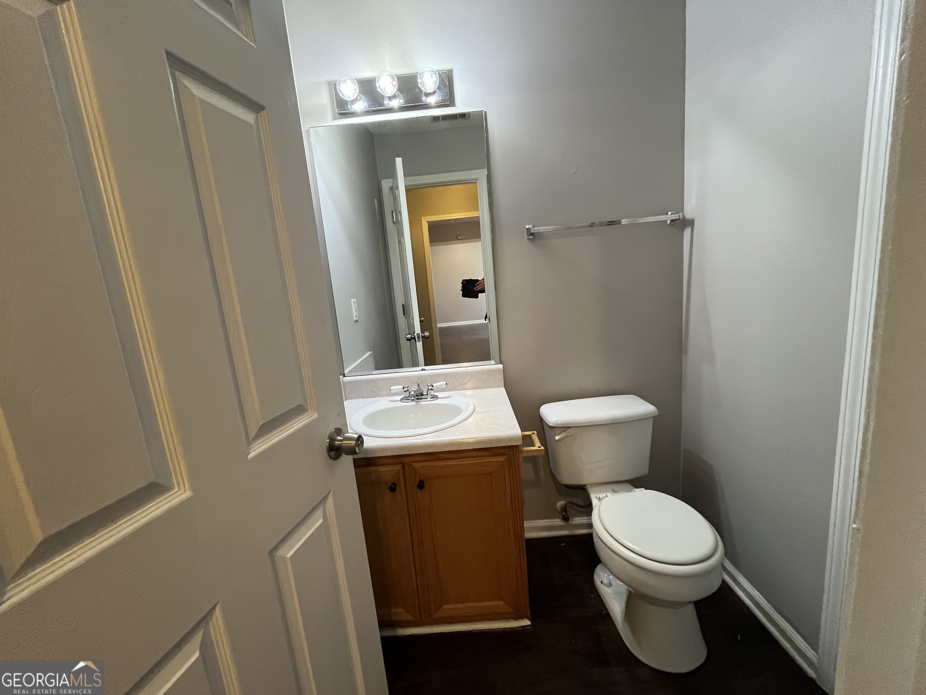 156 Galway Lane Hampton, GA 30228 - Photo 19 of 44 a bathroom with a sink a toilet and mirror