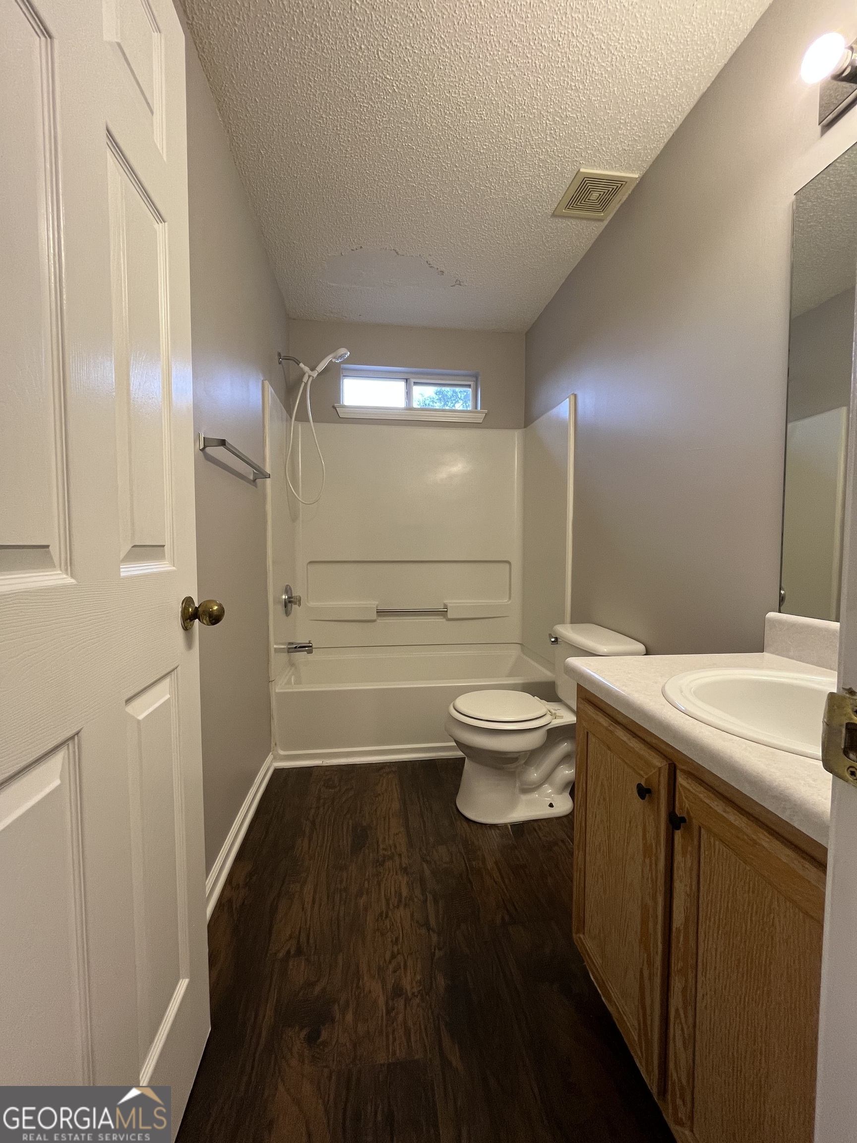 156 Galway Lane Hampton, GA 30228 - Photo 28 of 44 a bathroom with a sink a toilet and shower