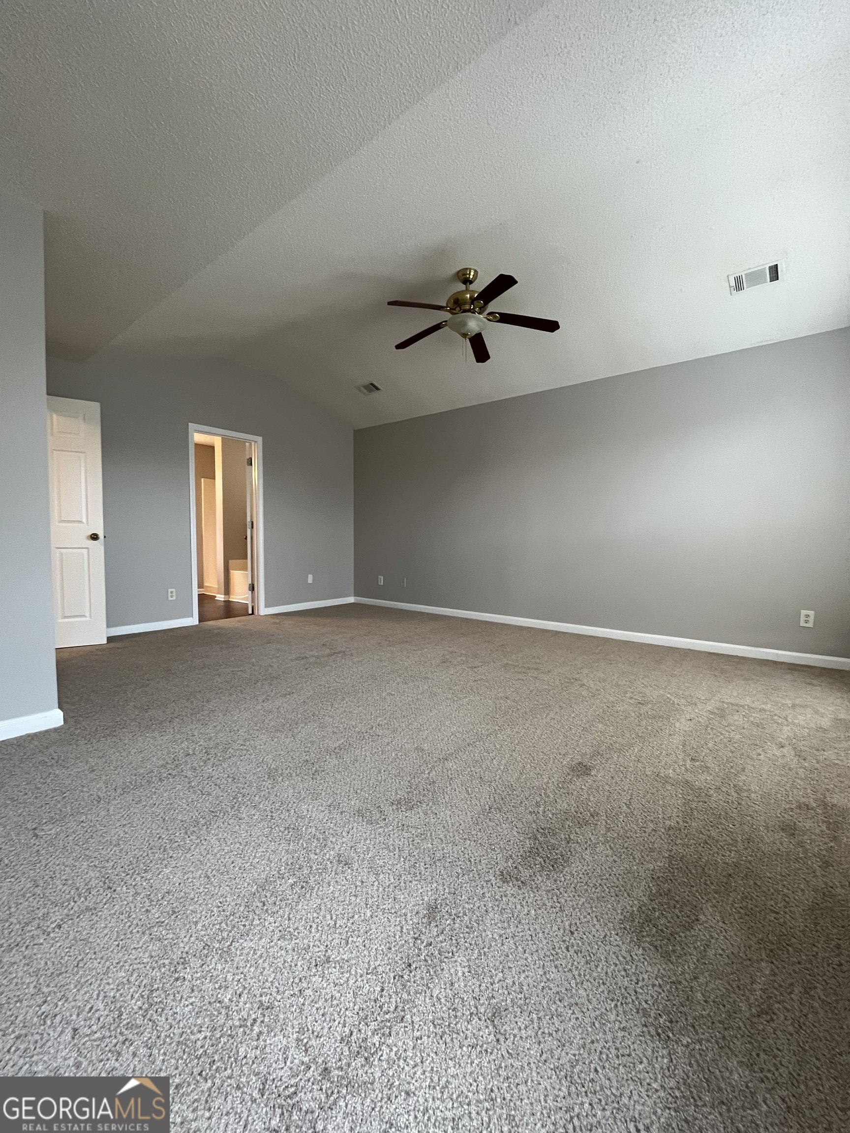 156 Galway Lane Hampton, GA 30228 - Photo 34 of 44 a view of an empty room with a ceiling fan