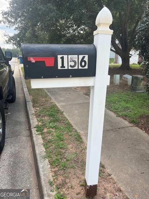 156 Galway Lane Hampton, GA 30228 - Photo 5 of 44 a sign that is on the side of a road