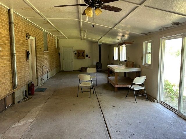 a outdoor space with lots of white furniture and a shower