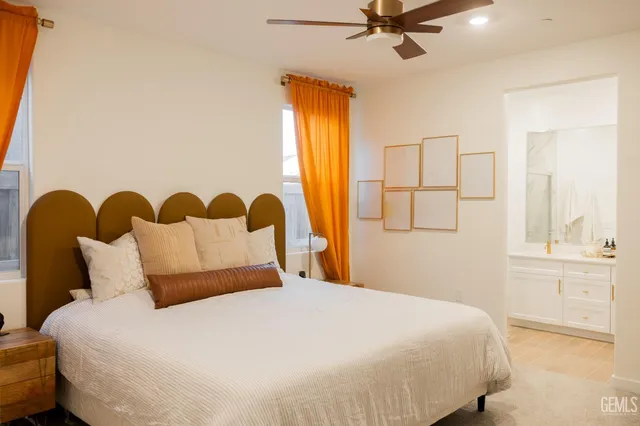 a bedroom with a bed and window