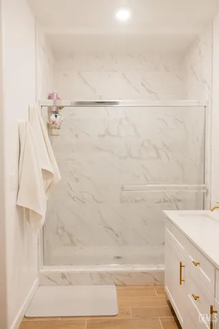 a bathroom with a bathtub and shower