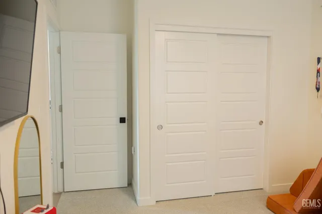 a room with a workspace and a couch